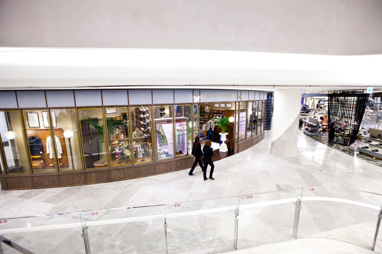 The bright interior of Lotte World Mall with shops and a glass balustrade, Seoul