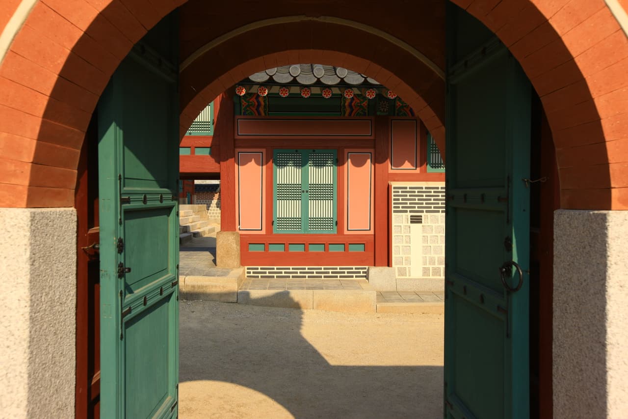 An open gate leading into a courtyard at Gyeongbokgung Palace in Seoul