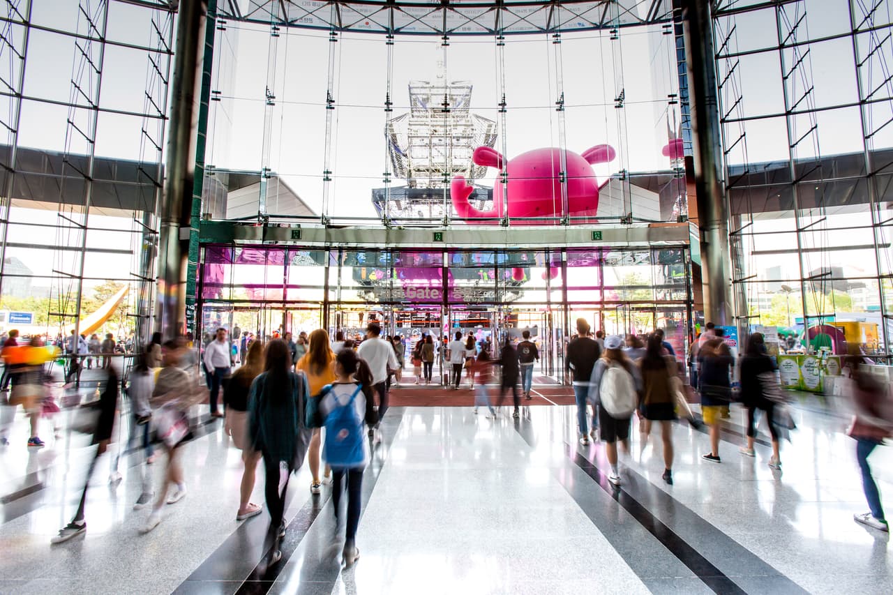 The bright glass atrium and busy concourse inside the COEX mall in Seoul
