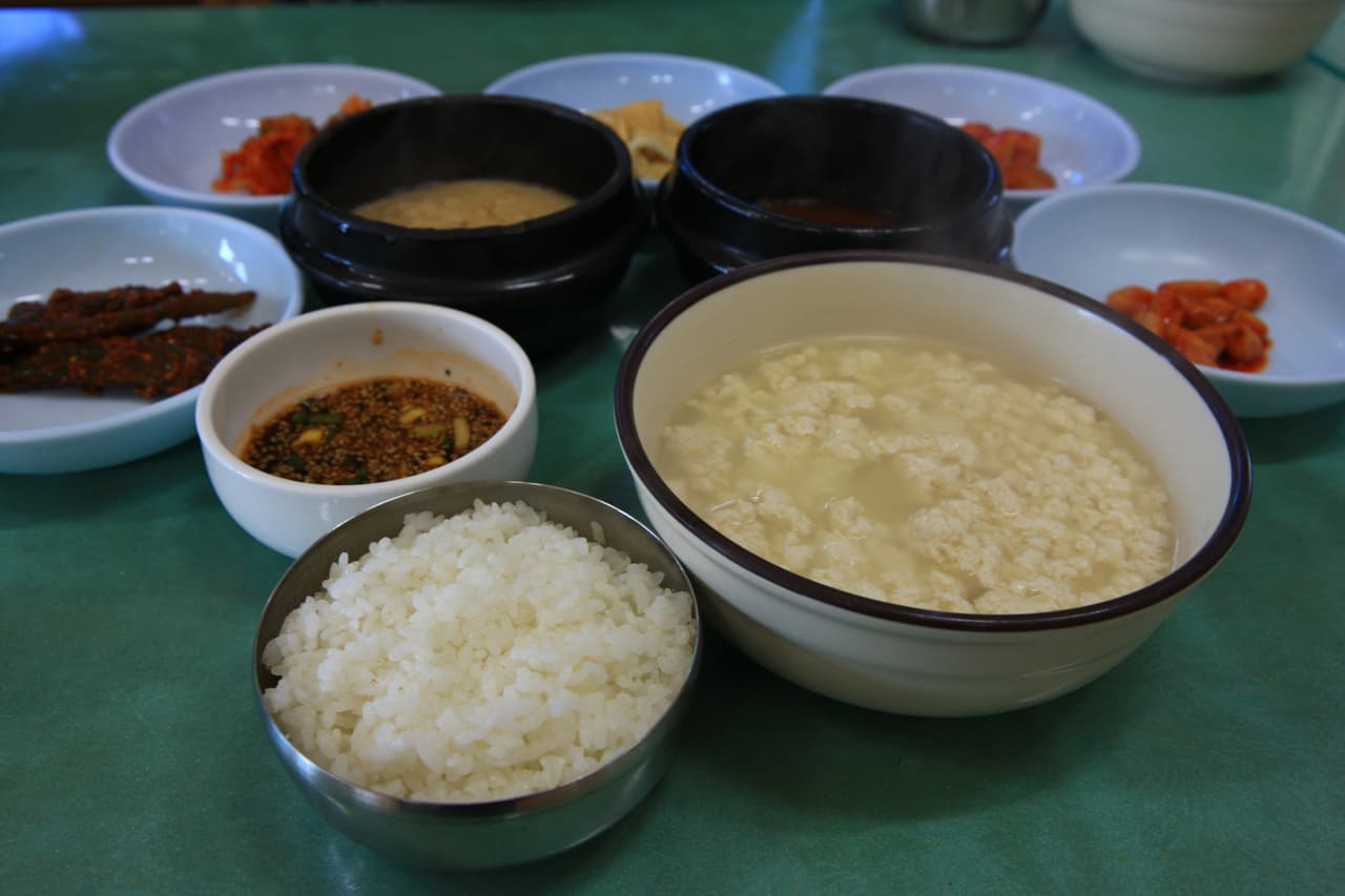 A bowl of Gangneung chodang soft tofu served with rice and side dishes