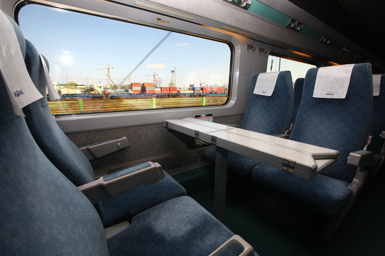 Facing seats with a table by the window inside a KTX high-speed train