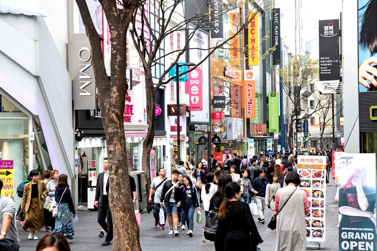 The pedestrian shopping street in Myeongdong, Seoul, busy with shoppers