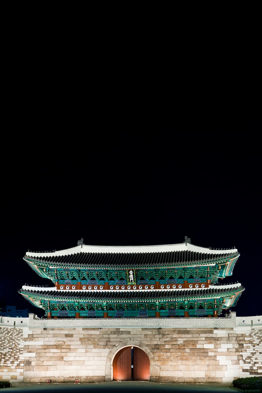 Sungnyemun Gate illuminated at night, the historic gate next to Namdaemun Market