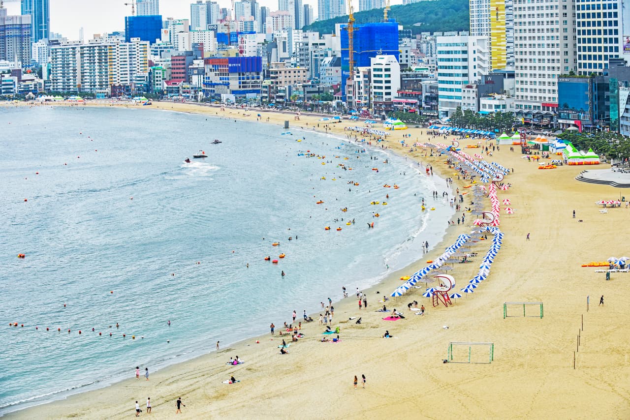 The curved cove of Gwangalli Beach in Busan, backed by the city