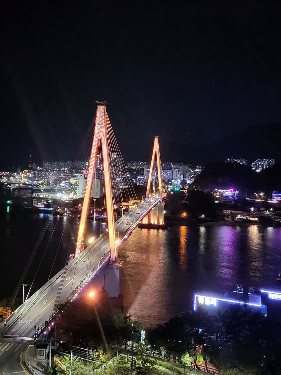 Dolsan Bridge lit up at night, seen from Dolsan Park in Yeosu