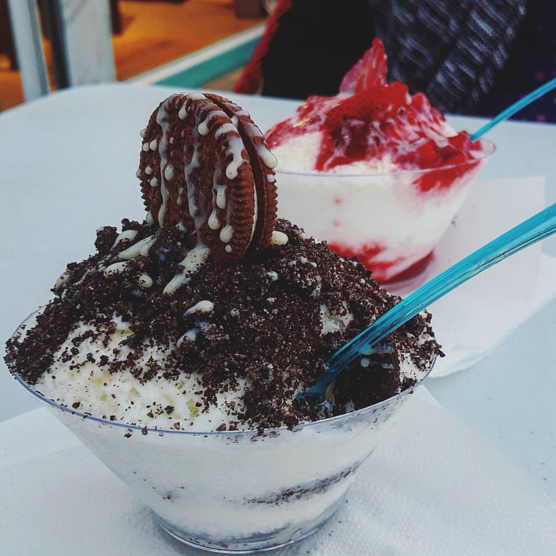 Two bowls of Korean bingsu shaved-ice dessert on a table