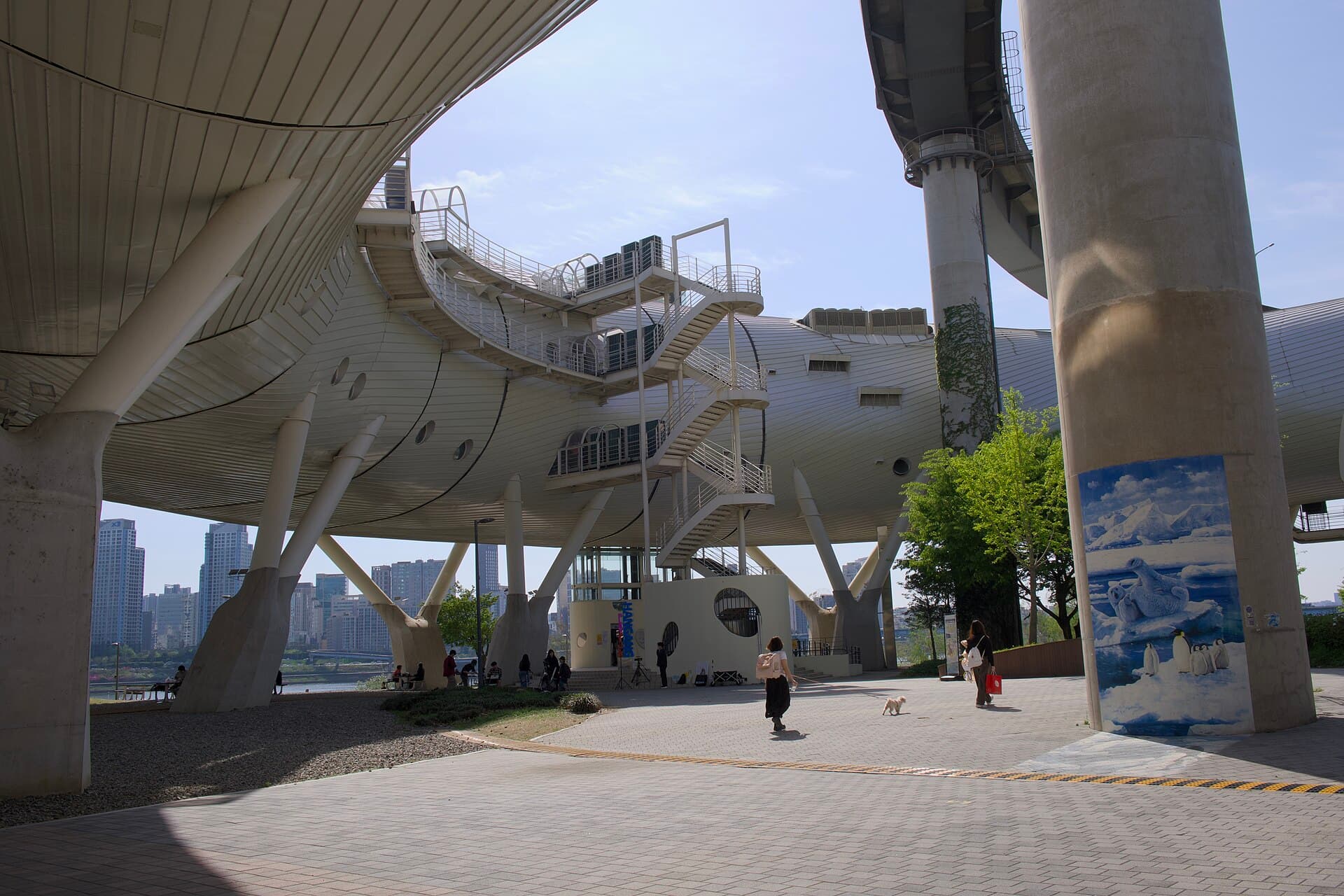 The curved Jabeolle building and elevated walkway at Ttukseom Hangang Park in Seoul