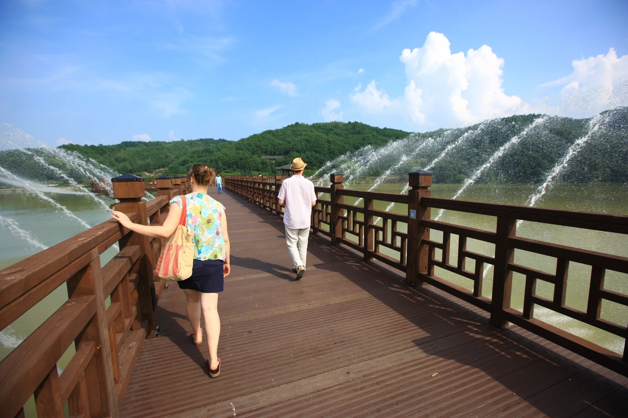 Wooden Woryeonggyo Bridge spanning the river under blue sky in Andong