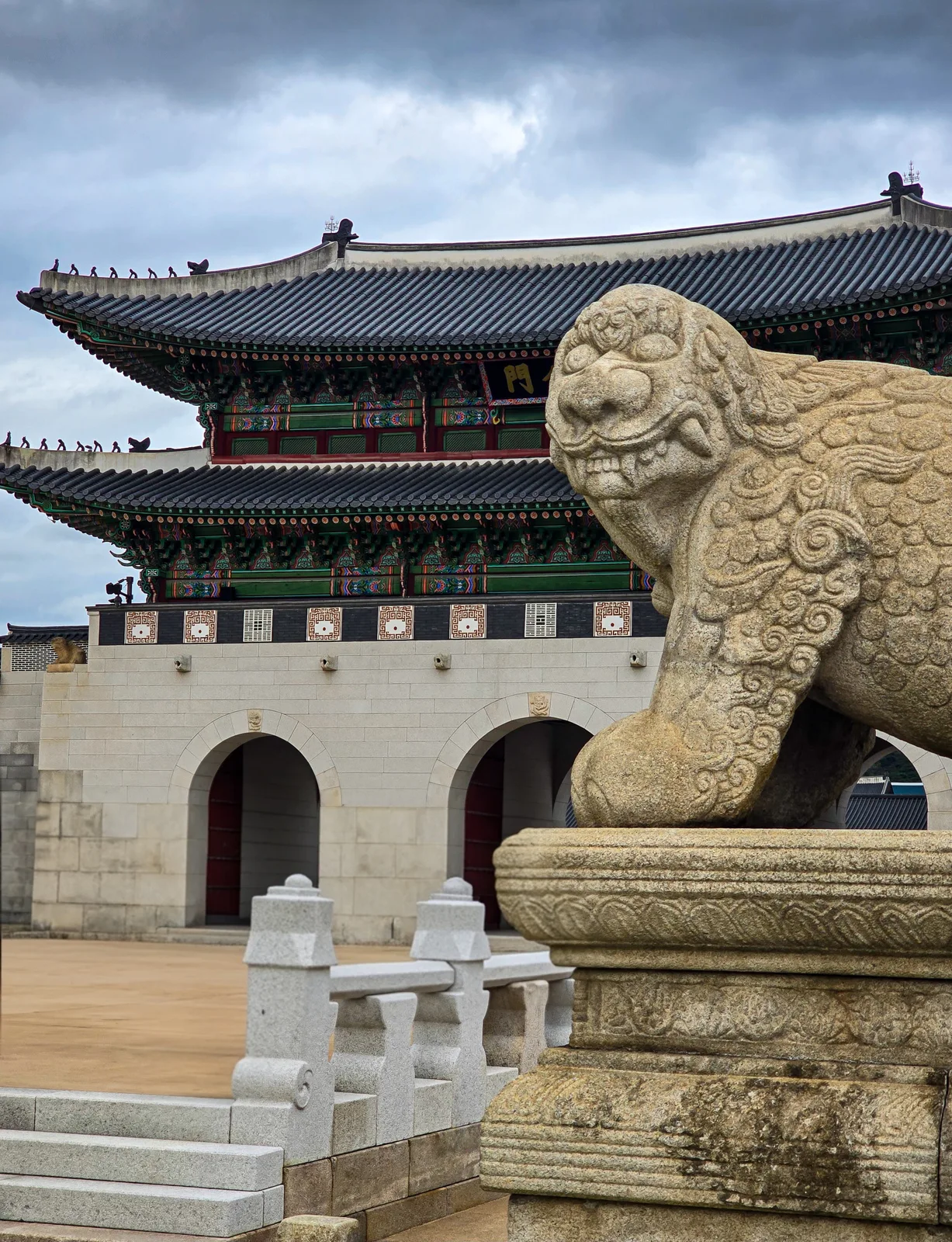 Gwanghwamun Gate and a stone haetae at Gyeongbokgung Palace in Seoul