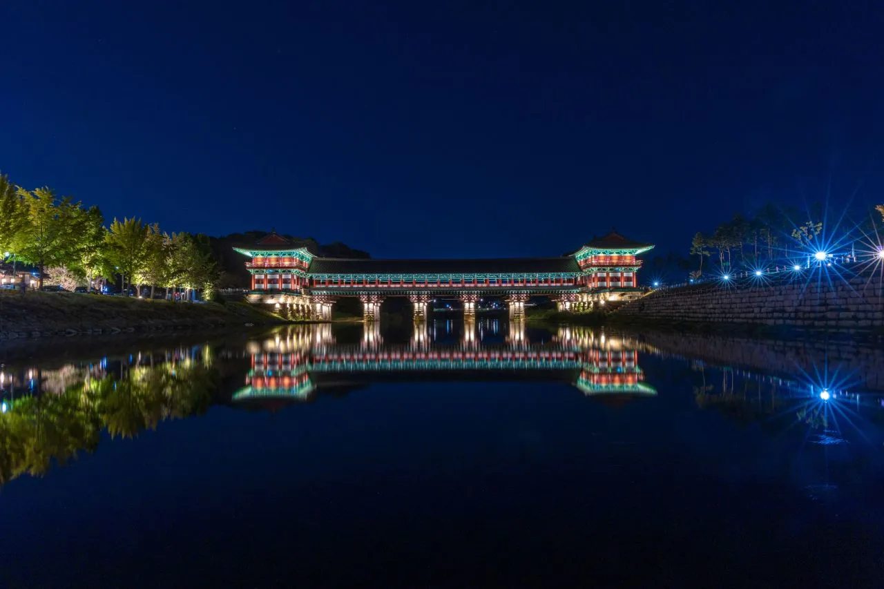 Woljeonggyo Bridge lit at night and reflected in the river in Gyeongju