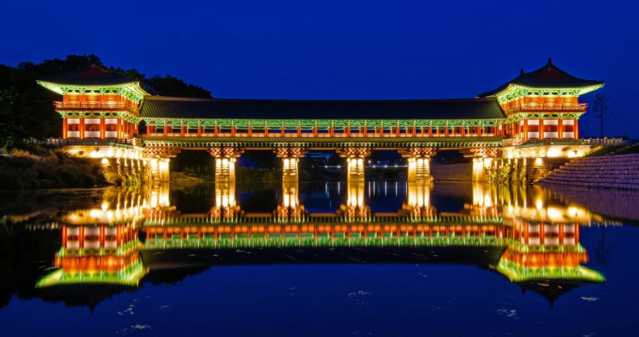 Woljeonggyo Bridge lit at night and reflected in the river in Gyeongju
