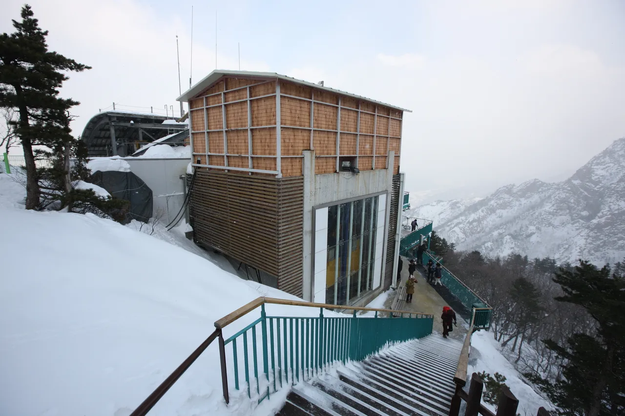 Snow-covered stairs beside the cable car upper station at Gwongeumseong in Seoraksan