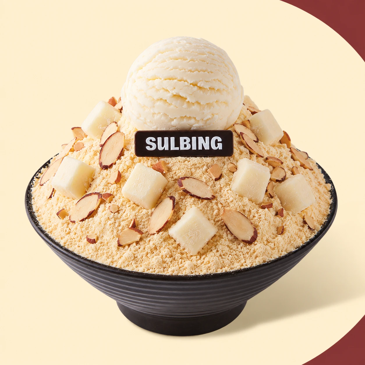 Injeolmi sulbing in a Sulbing bowl: milk-snow ice topped with roasted soybean powder and chewy rice cake